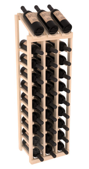 Tall light-wood wine rack with three columns of horizontal bottle slots and a slanted top shelf displaying four wine bottles.